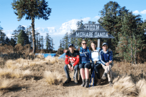 Tourist taking a rest at Mohare Danda Nepal