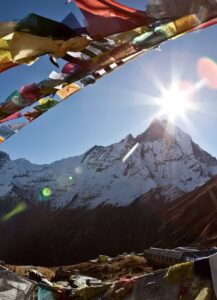 sunrise and praying flag over himalaya